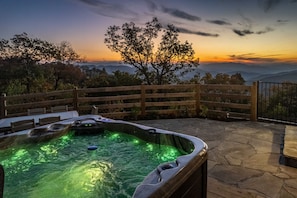 Hot tub - Uncovered hot tub on back patio facing beautiful mountain scenery.