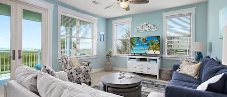 Living area has lots of comfortable seating, LED smart TV, high speed wireless internet and beautiful front row ocean views.