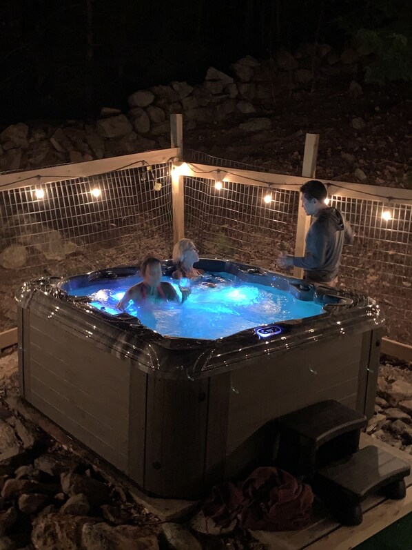  new hot tub- 51 jets- waterfall- in fenced yard with astroturf and yard games.