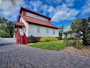 Front of house and private driveway.