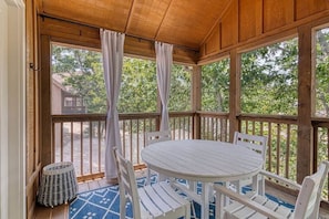 Enjoy a meal or a coffee on the back deck looking at the water through the trees!