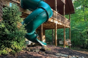 Ready to explore the surrounding woods, why take the stairs when you can slide instead! It's the quickest way to get to the outdoors!
