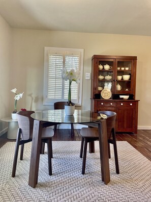 Dining:  Get ready to feast in style in our dining area, complete with a sleek blu dot dinette and chairs. The cherry step-back china cabinet from the 1800s adds a touch of vintage charm, and it's even filled with a display of beautiful depression-era Fiestaware serving pieces. Whether you're enjoying a quick breakfast or hosting a formal dinner party, this dining area has ever...