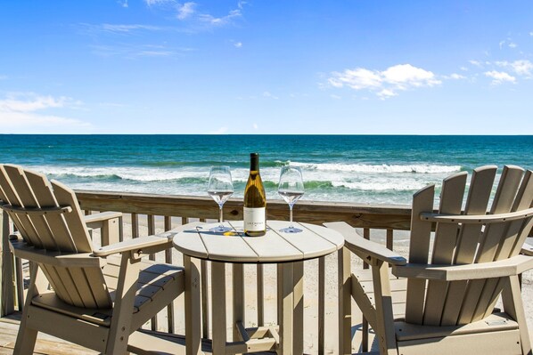 Top deck features 4 bar height chairs with 2 tables and 2 rocking chairs