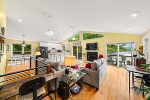 Large open concept living area with double sliding doors