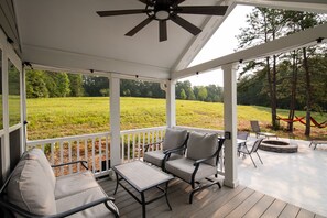 Covered porch seating area.