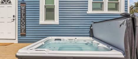 Relax in the hot tub that is one of the top features at Big Blue. Enjoy the convenience of keyless entry at the door shown at left.