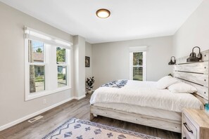 You’ll find the primary bedroom with en-suite bathroom conveniently located on the first floor and featuring a king bed.