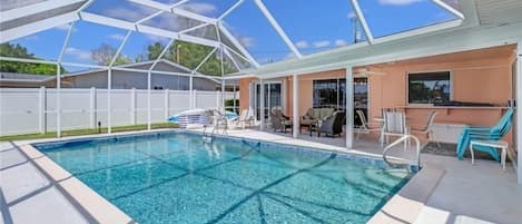 An abundance of sunshine and space to layout by the pool with screen protection.