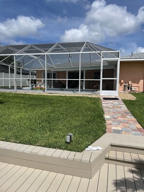 View of pool and back of house from dock.