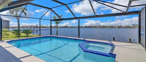Located on Britannia Lake, Eight Lakes area of Cape Coral, this vacation home w/heated pool, spa and waterfront-water-lovers dream!