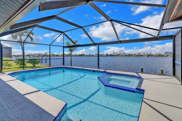 Located on Britannia Lake, Eight Lakes area of Cape Coral, this vacation home w/heated pool, spa and waterfront-water-lovers dream!