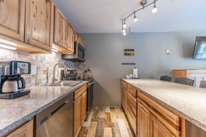 Full-sized kitchen with upgraded appliances.