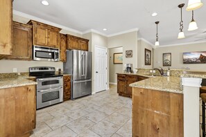 The kitchen features stainless steel appliances