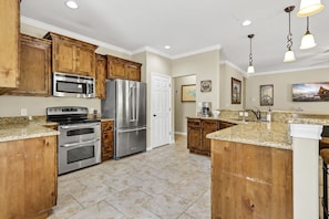 The kitchen features stainless steel appliances