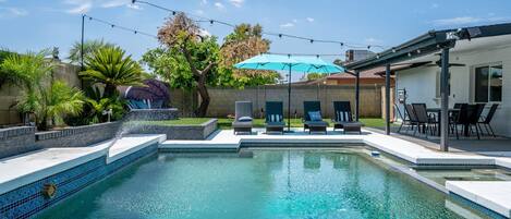 Sparkling pool with plenty of places to lounge!