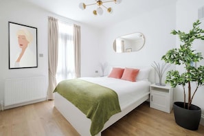 Bedroom 2 with king bed & A/C for a restful and comfortable stay.