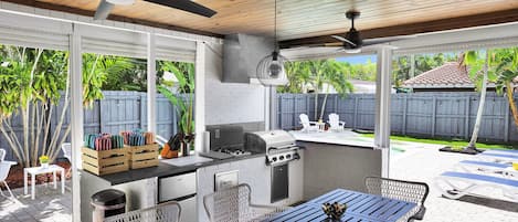 Fully equipped outdoor kitchen and dining close to the pool perfect for sharing