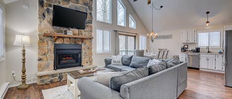 Relax in our cozy living room area featuring a fireplace with electric insert.