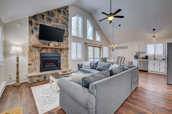 Relax in our cozy living room area featuring a fireplace with electric insert.
