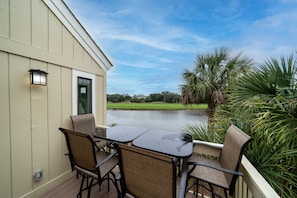 The front deck provides serene outdoor space to relax while watching the bird life on the pond.