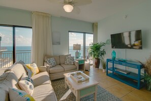 Living room with comfortable couch that converts into a sleeper sofa + loveseat for additional seating!