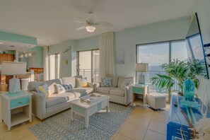 That view!!! Spacious living area featuring a large smart TV! Perfect for unwinding after a day exploring PCB!