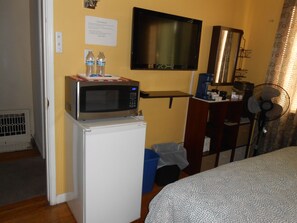 32" HDTV with Fire TV stick. Mini Fridge & microwave.