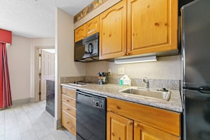 Granite countertops, fully stocked kitchen, full size dishwasher.