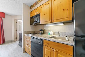 Granite countertops, fully stocked kitchen, full size dishwasher.