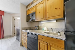 Granite countertops, fully stocked kitchen, full size dishwasher.