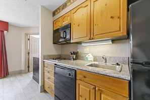 Granite countertops, fully stocked kitchen, full size dishwasher.