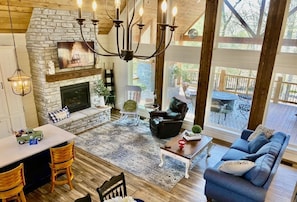 Gorgeous new farmhouse with tons of shiplap & floor to ceiling windows. So cozy!