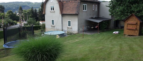 A family house with garden, terrace and grill