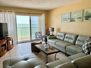 The living room offers balcony access & great views, with a Smart TV and cable.