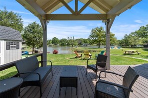 Play corn hole or plan a picnic with a breeze from the ceiling fan and gazebo.