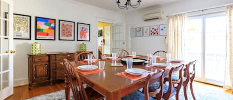 A large dining room table comfortably seats 10 people for large gatherings,