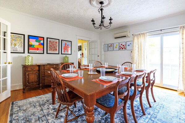 A large dining room table comfortably seats 10 people for large gatherings,