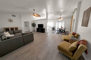 Spacious living space - open kitchen to living and dining rooms. Couch and chairs can be converted to beds. BOHO style design