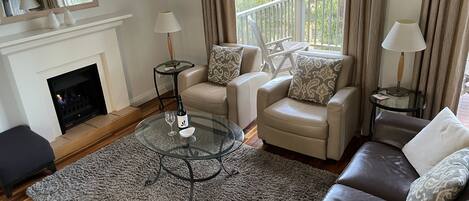 Lovely living room with TV with Foxtel and gas fireplace 