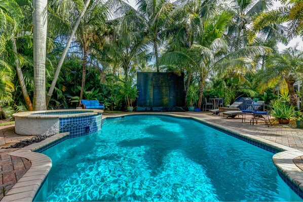 The rain wall at the edge of the pool creates the perfect vacation soundtrack. 