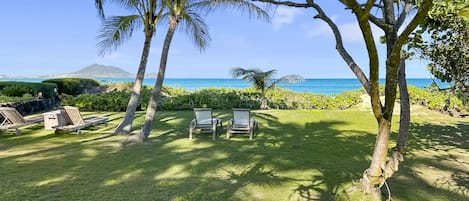 Enjoy views of the tropical landscape and ocean from the front porch