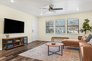 Living room with 60" 4K Roku Smart TV 