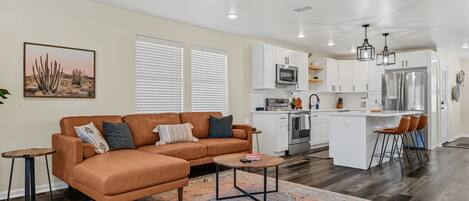 Open concept living room and kitchen with island