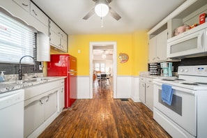 Kitchen opens up to the large backyard.