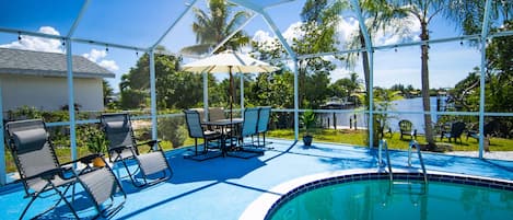 Outdoor Lanai: with private pool, outdoor furniture, & view of the canal