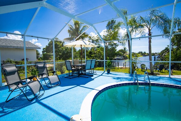 Outdoor Lanai: with private pool, outdoor furniture, & view of the canal