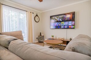 "Enjoy a fun-filled evening in our spacious living room."

