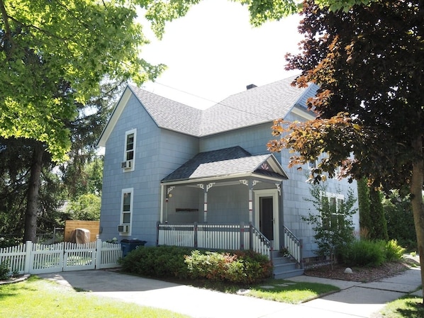 EXTERIOR: The front of the home in summer.