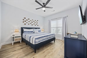 You’ll love this amazing King bedroom that includes an ensuite bathroom to your left, a work station and a Smart TV.
